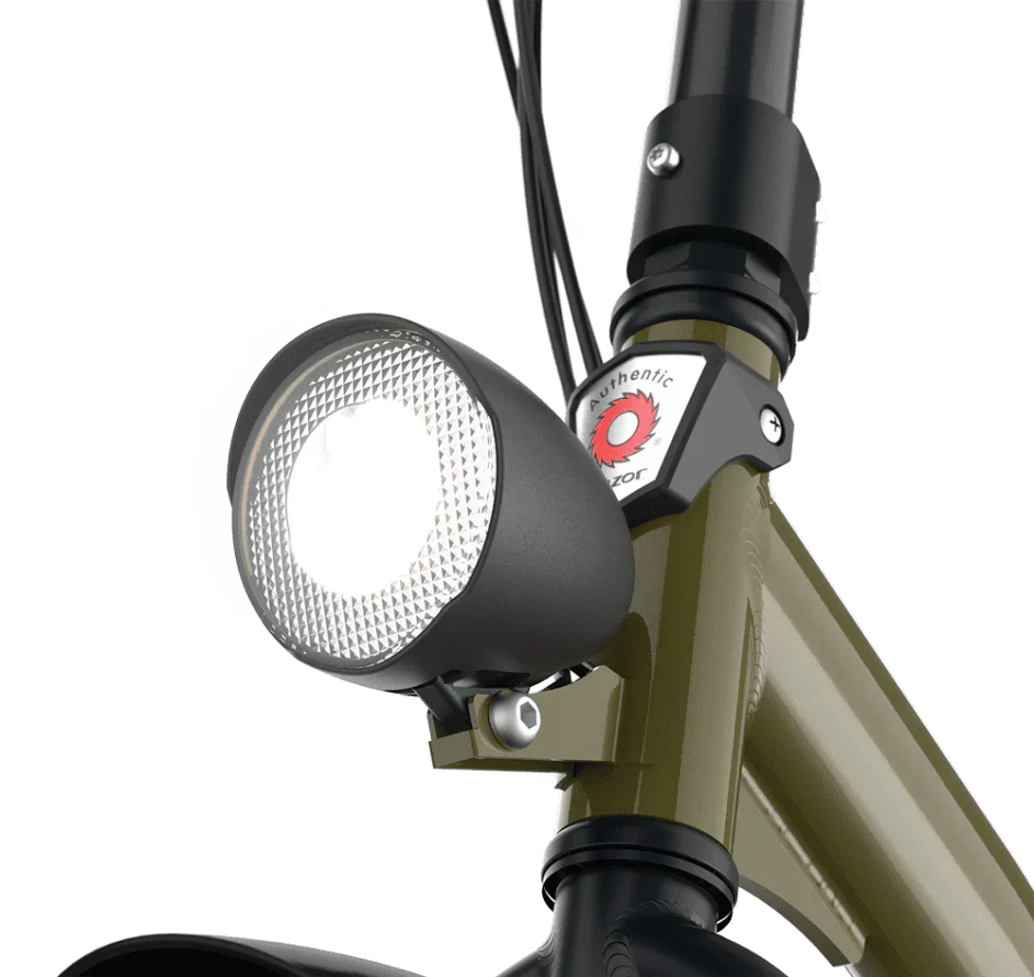 Close-up of a bicycle headlight attached to a bike frame with a white background
